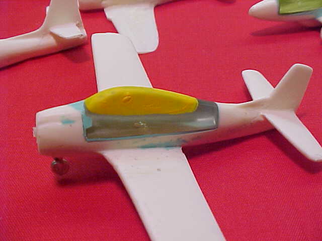 THE CLEAR PART OF THE CANOPY IS MASKED OFF WITH ELMERS GLUE MIXED WITH POSTER PAINT. AFTER THE MODEL HAS BEEN PAINTED AND CLEAR-COATED, THE MASKING IS EASY TO REMOVE WITH A TOOTHPICK OR FINGERNAIL. NEXT THE FUSELAGE AREA OF THE CLEAR PART MUST BE PAINTED WITH THE DESIRED INTERIOR COLOR BEFORE THE MODEL IS PAINTED. WHEN YOU LOOK IN THE COCK PIT YOU WILL SEE THE INSIDES OF THE CLEAR PART.